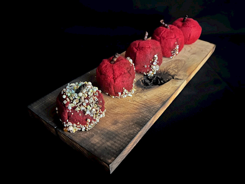 Kathryn M.O., "Apples," felt, beads, and wool, 4 x 6.5 x 18 in., Parkview Arts & Science Magnet High School, Art Educator: Maribeth Anders.