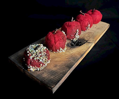 Kathryn M.O., "Apples," felt, beads, and wool, 4 x 6.5 x 18 in., Parkview Arts & Science Magnet High School, Art Educator: Maribeth Anders.
